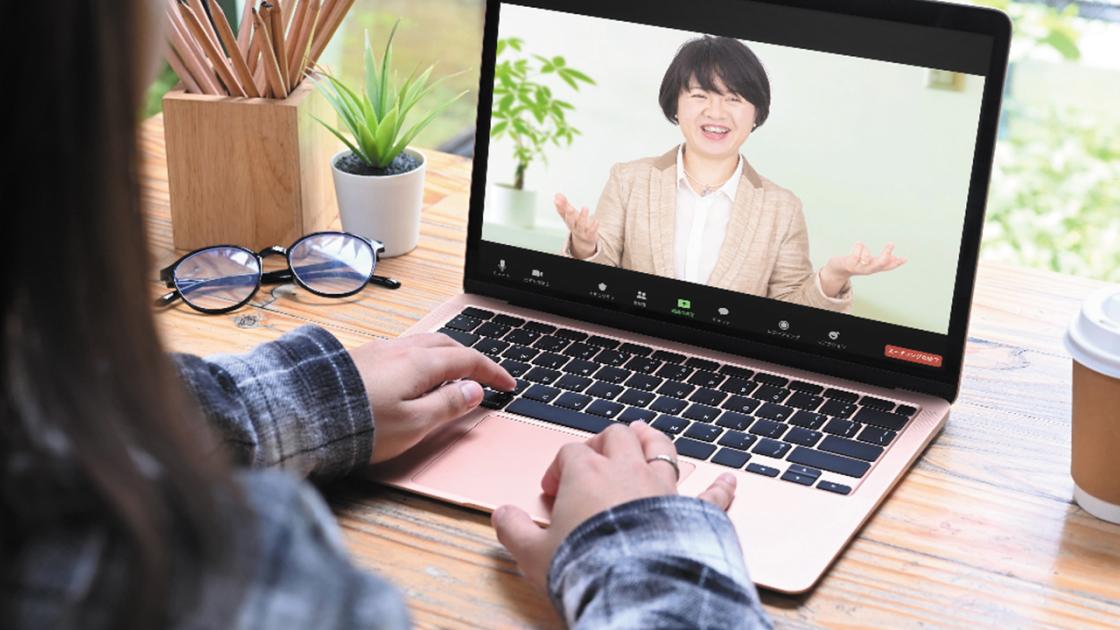 A woman attending a lecture online